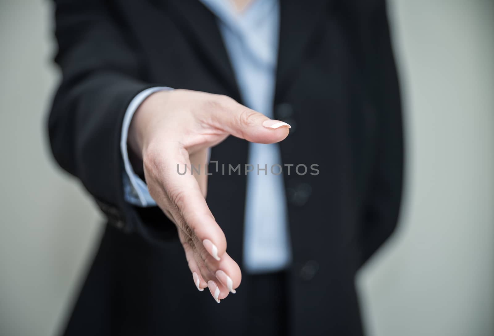 Woman ready for hand shake by IVYPHOTOS