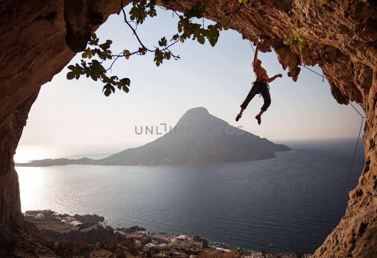 Rock climber at sunset. Kalymnos Island, Greece.