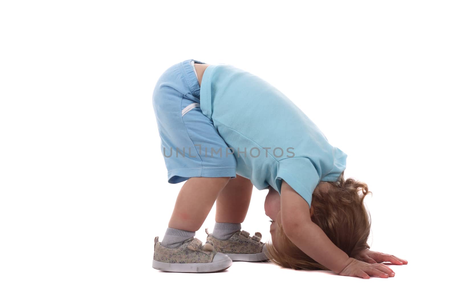 A little boy on all fours isolated on the white