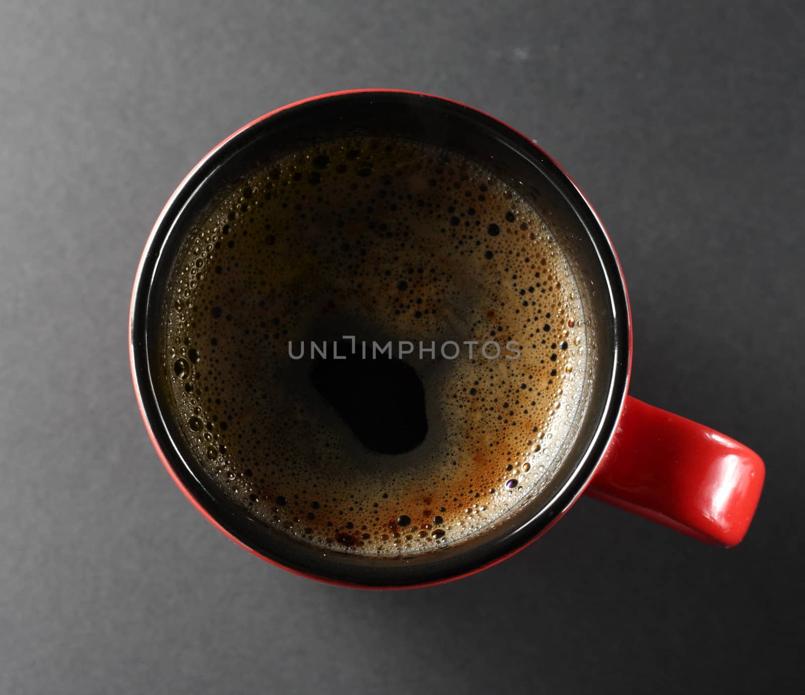 Cup of coffe from above view on a dark background