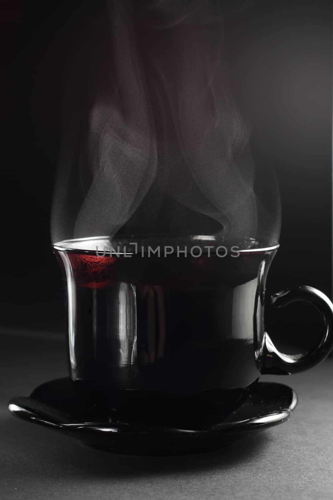 Cup of tea on the dark background