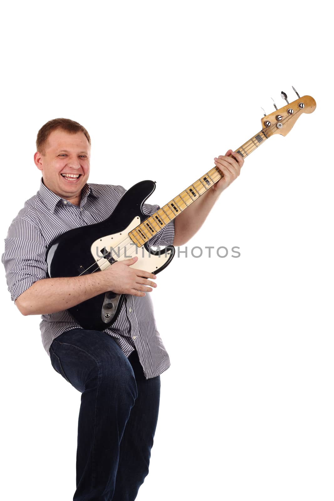 Young man playing guitar isolated on the white