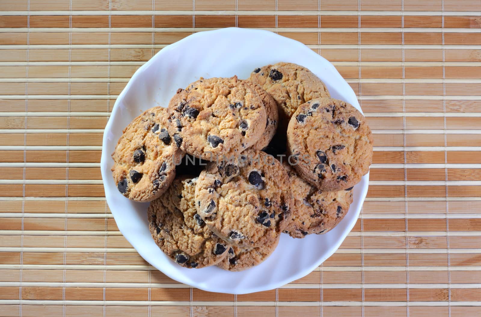 Some cookies on the plate at the textured background