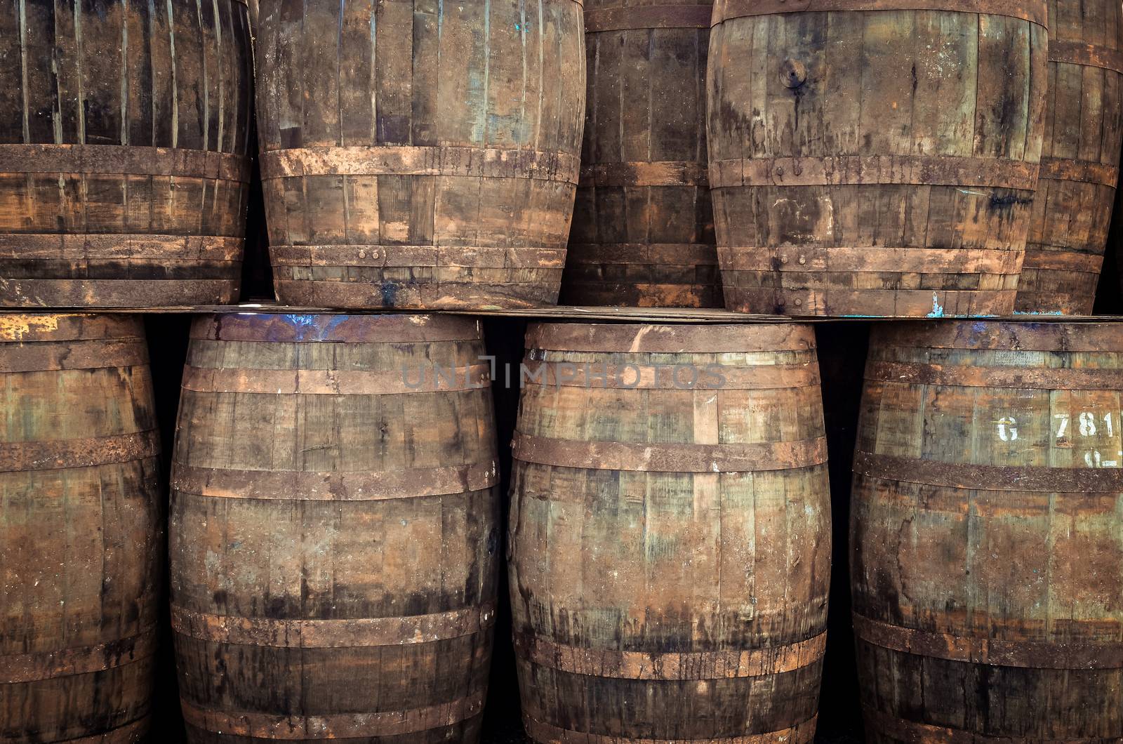 Stacked pile of old whisky barrels