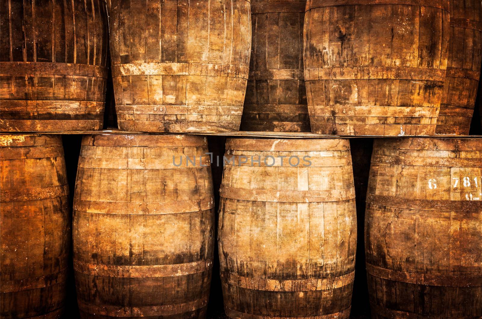 Stacked whisky barrels in monochrome vintage style