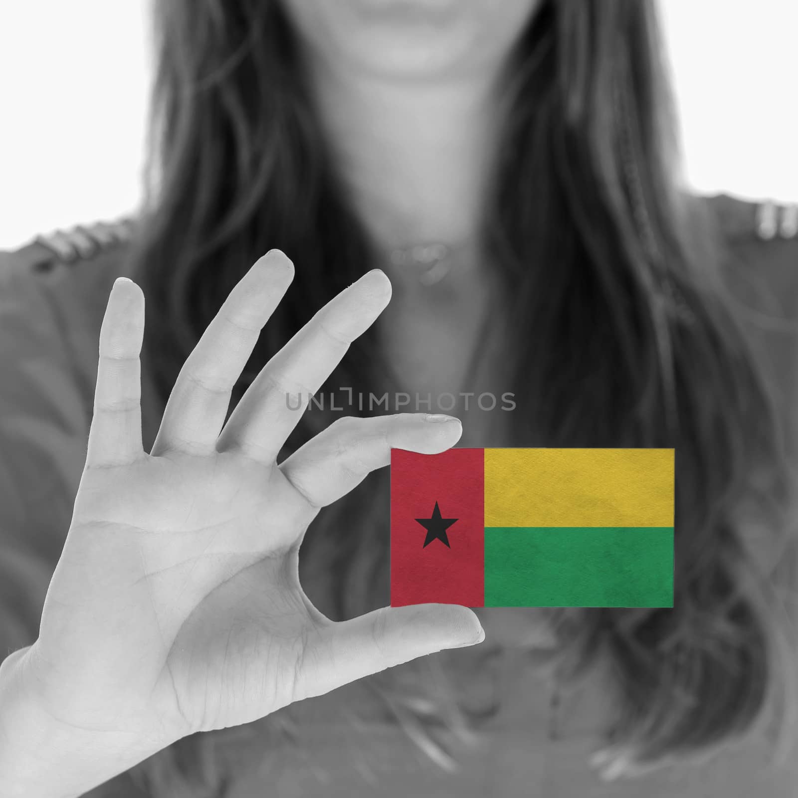 Woman showing a business card, flag of