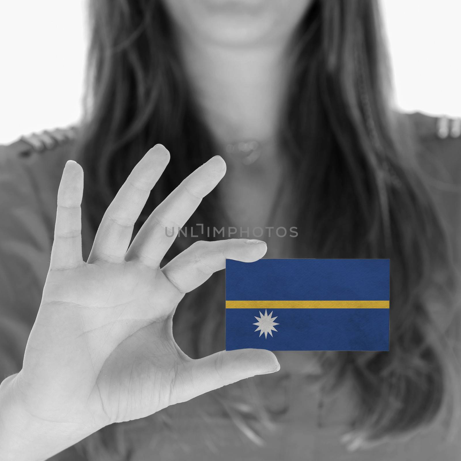 Woman showing a business card, flag of Nauru