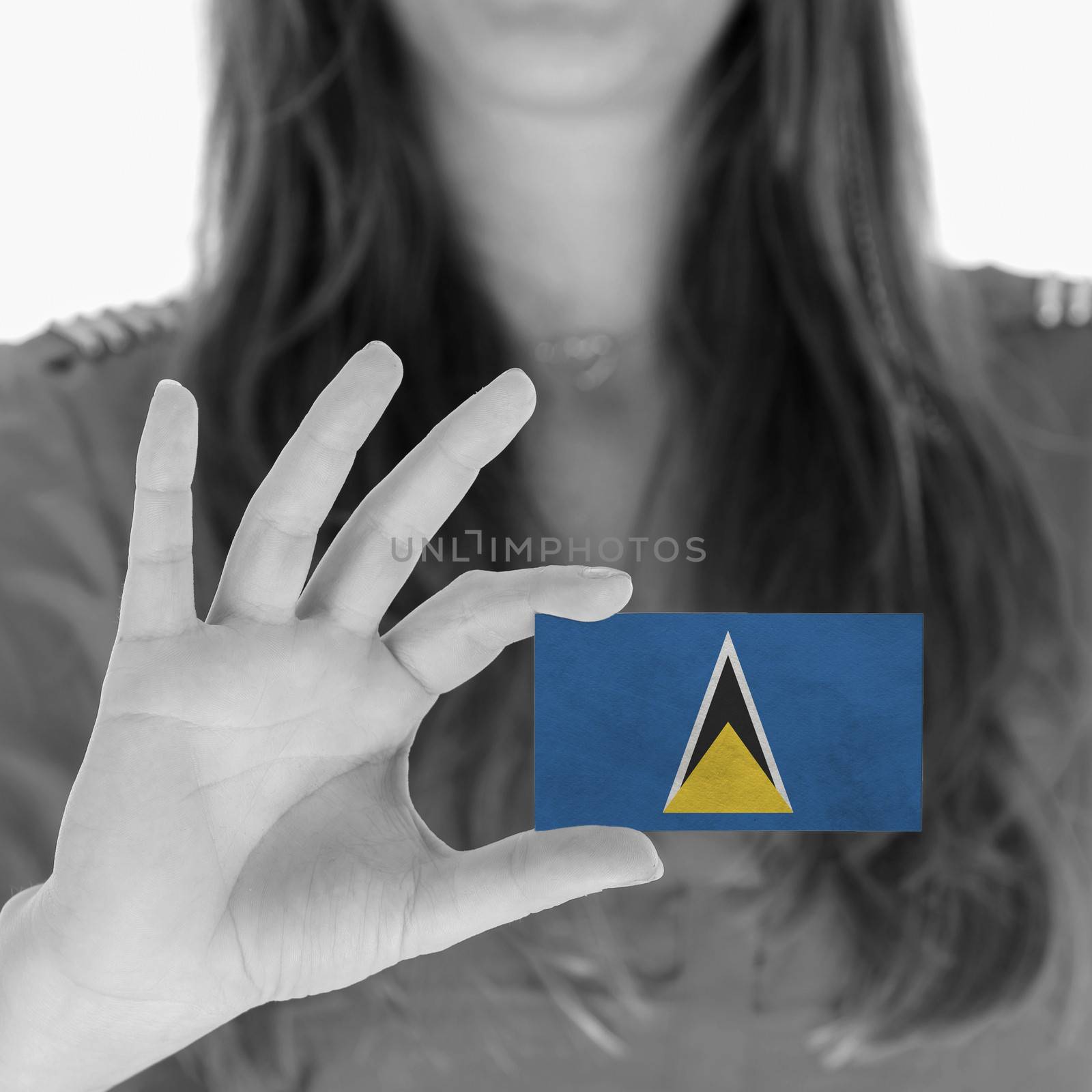 Woman showing a business card, flag of Saint Lucia