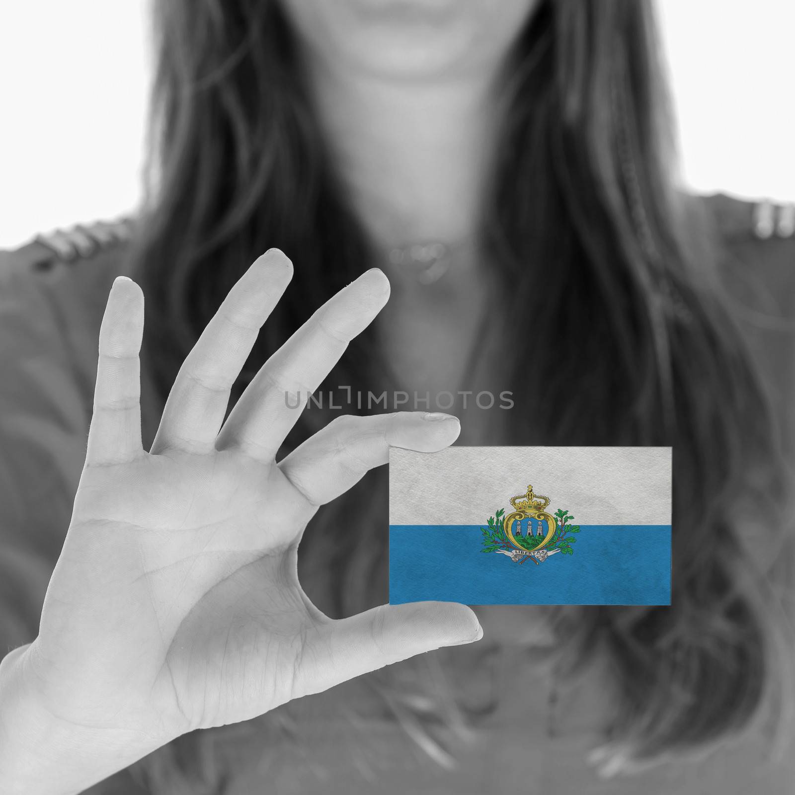Woman showing a business card, flag of San Marino