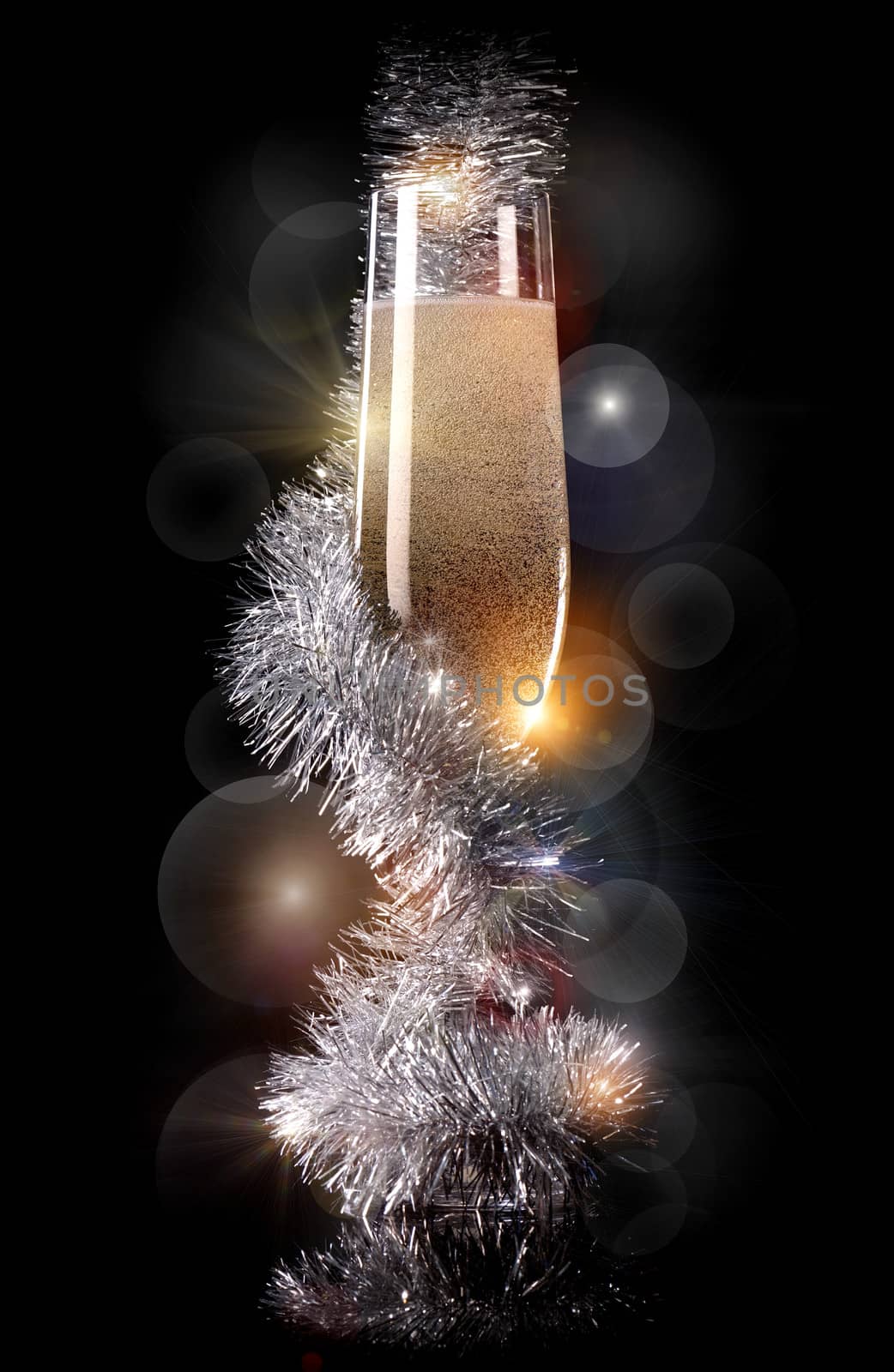 Glass of champagne with beautiful Christmas decorations