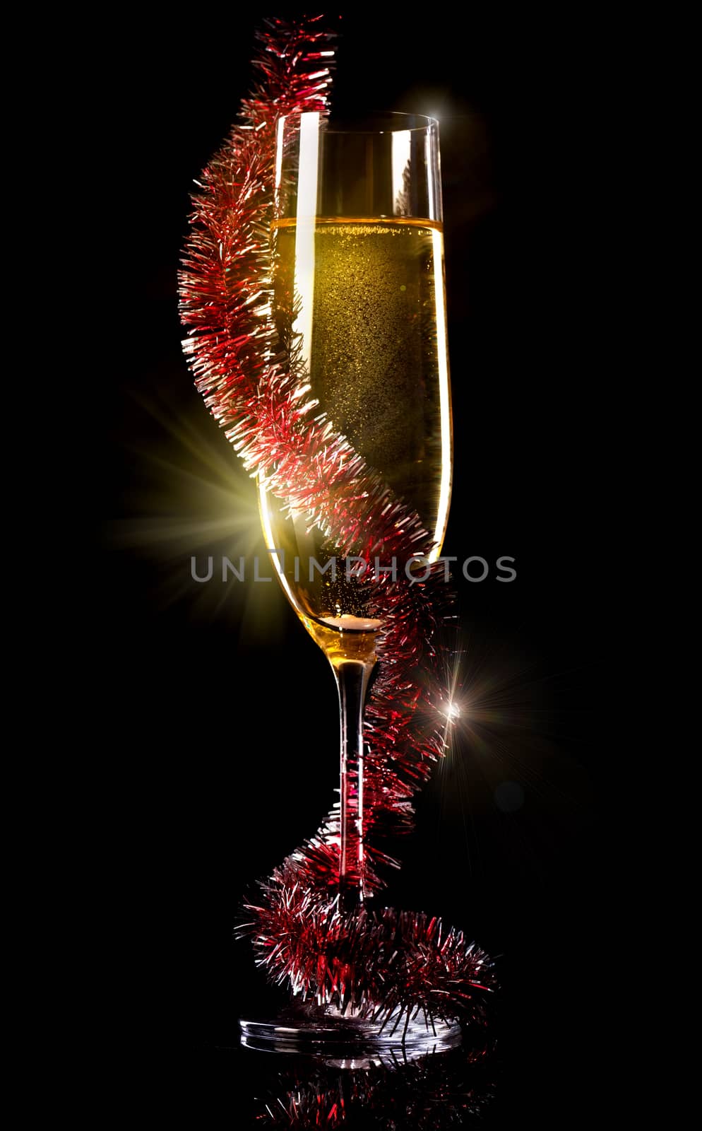 Champagne in glass on a black background