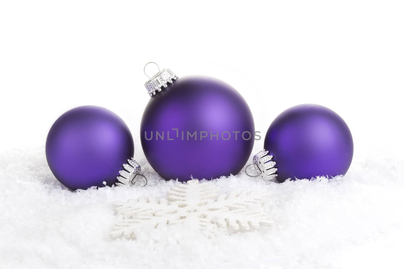 Christmas balls purple with star on white background 
