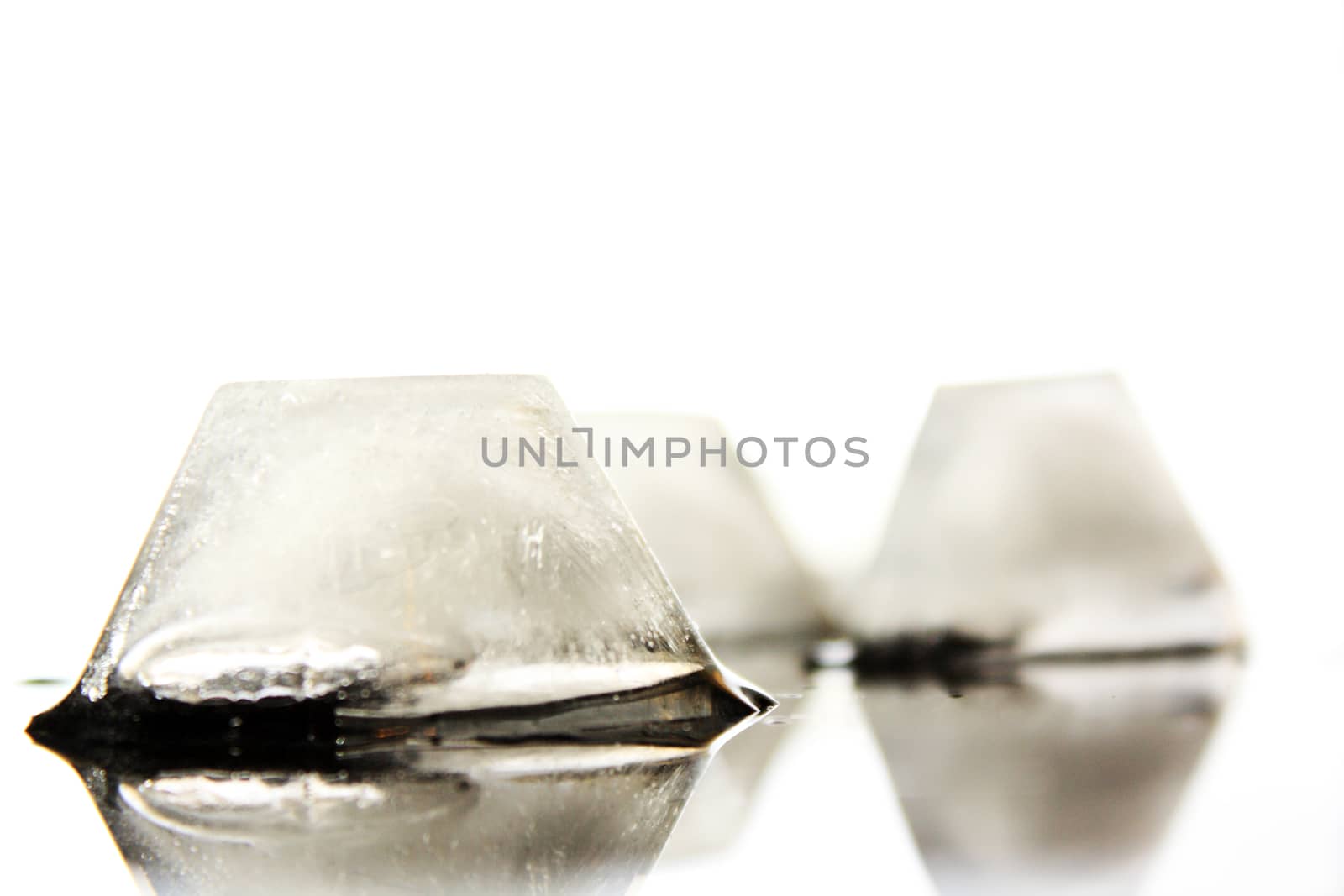 several ice cubes in the form of ground without background 