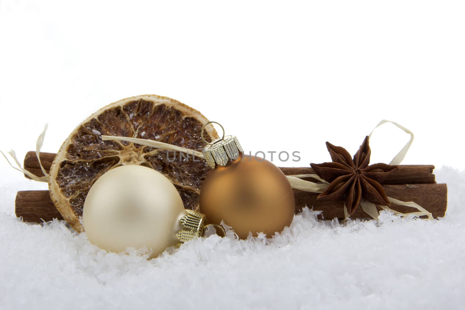 Christmas decoration, balls on  snow with white background 