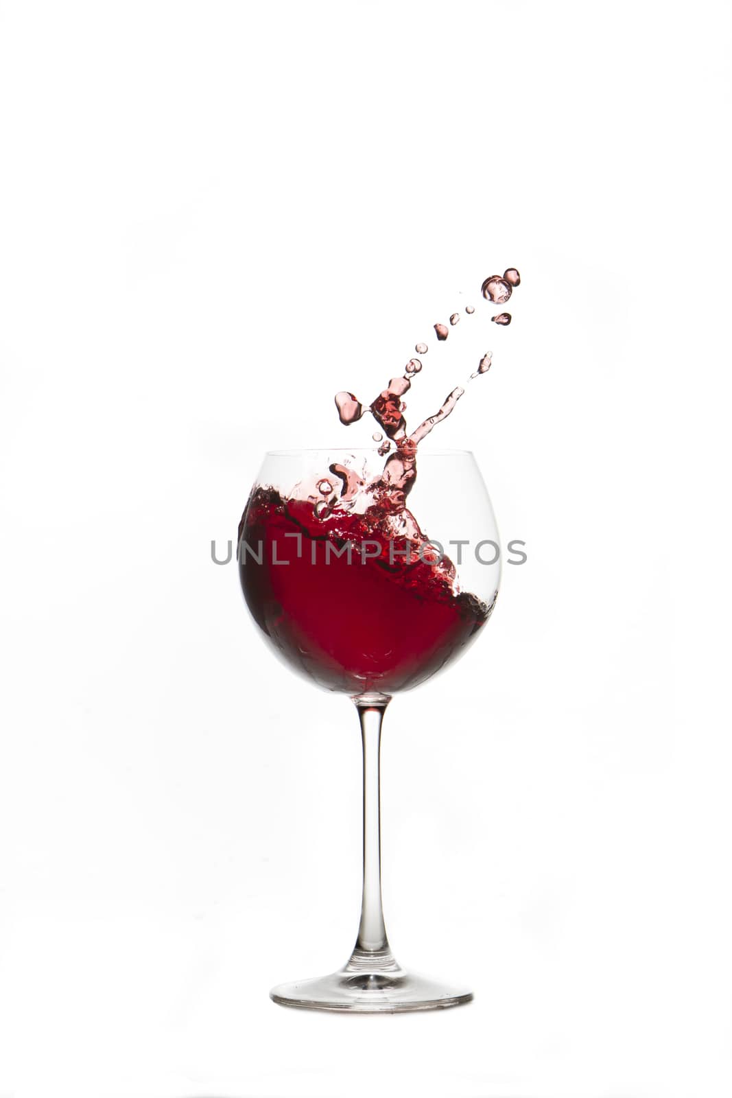 Red wine splash Glass with white background 