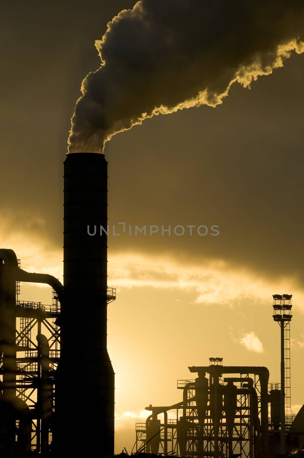 Sunset silhouette of industrial plant