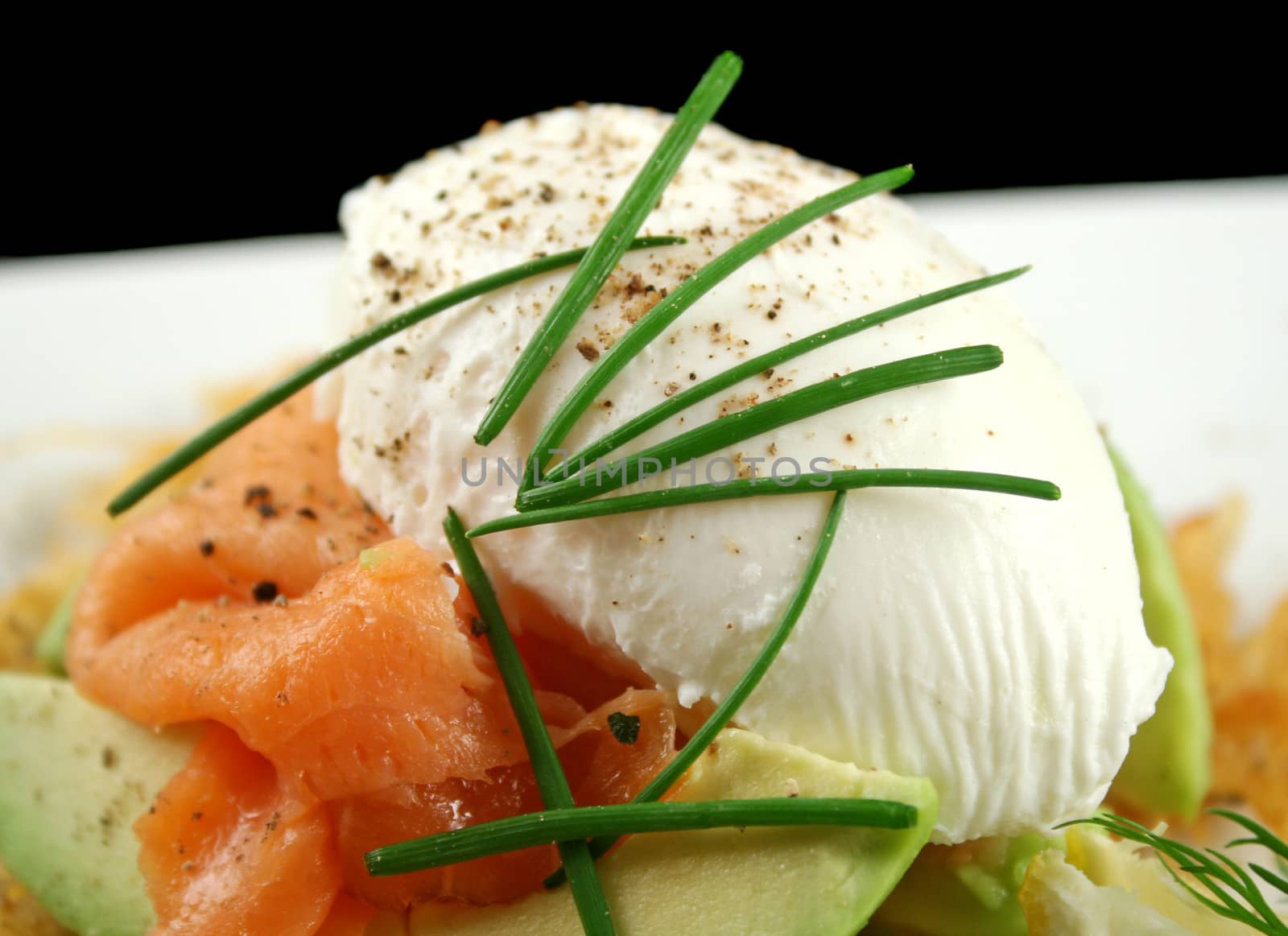 Beautiful salmon and poached egg stack with avocado.