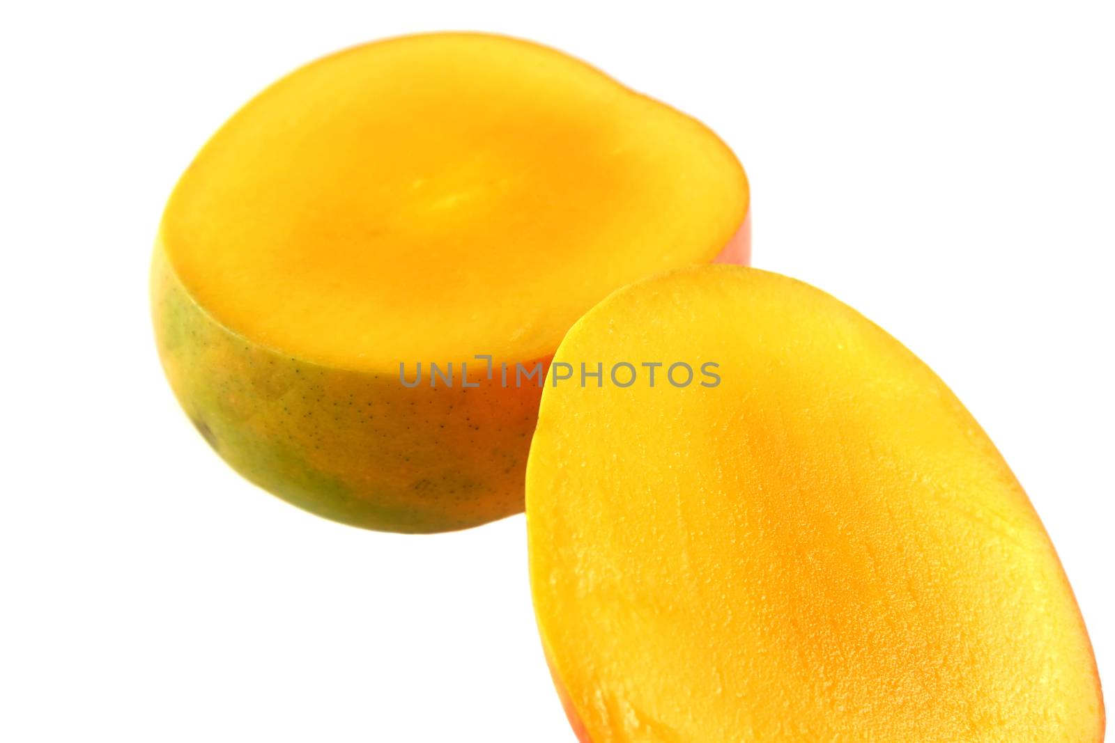 Fresh colorful mango sliced in half.