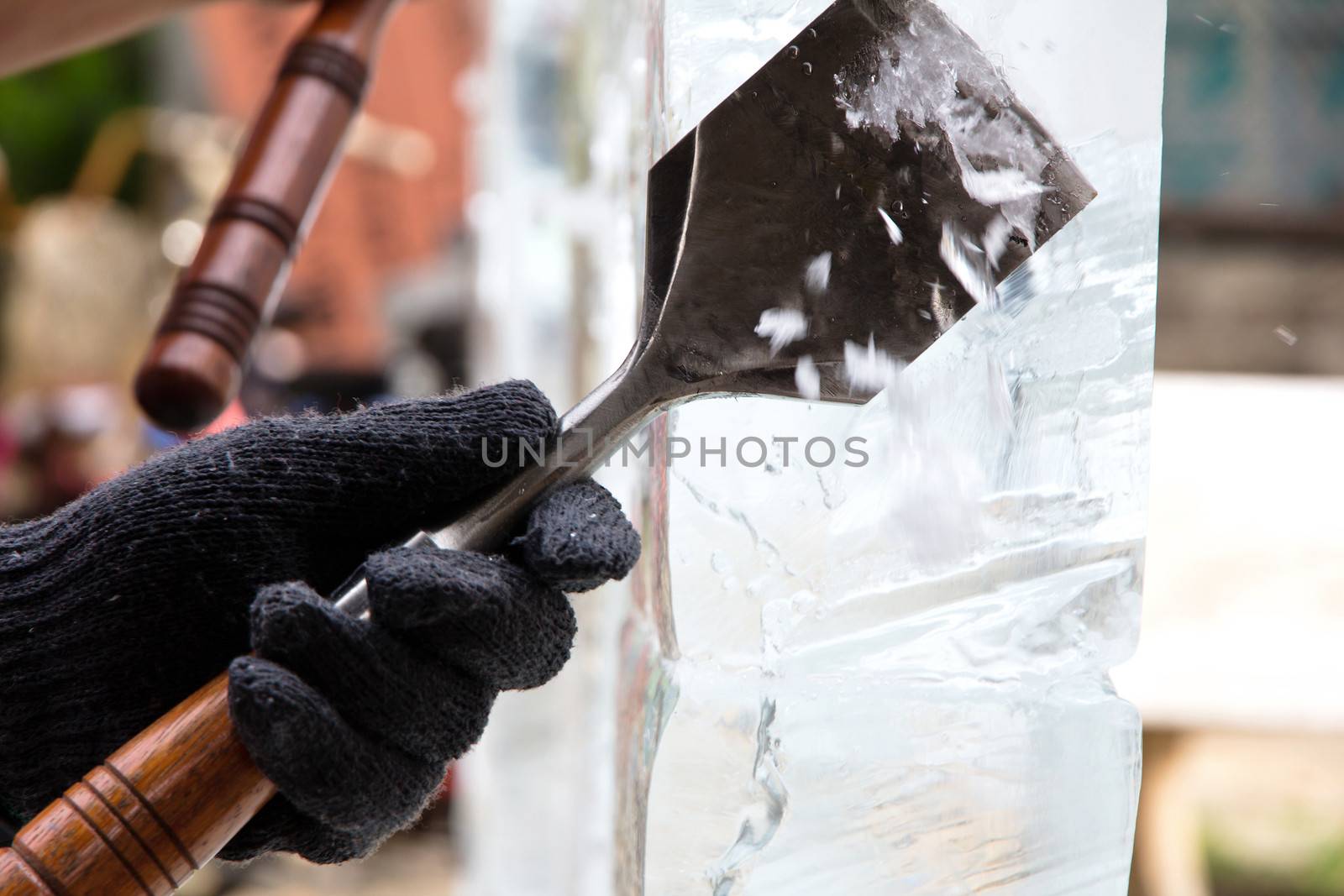 Ice Carver Using Chisel to Carve