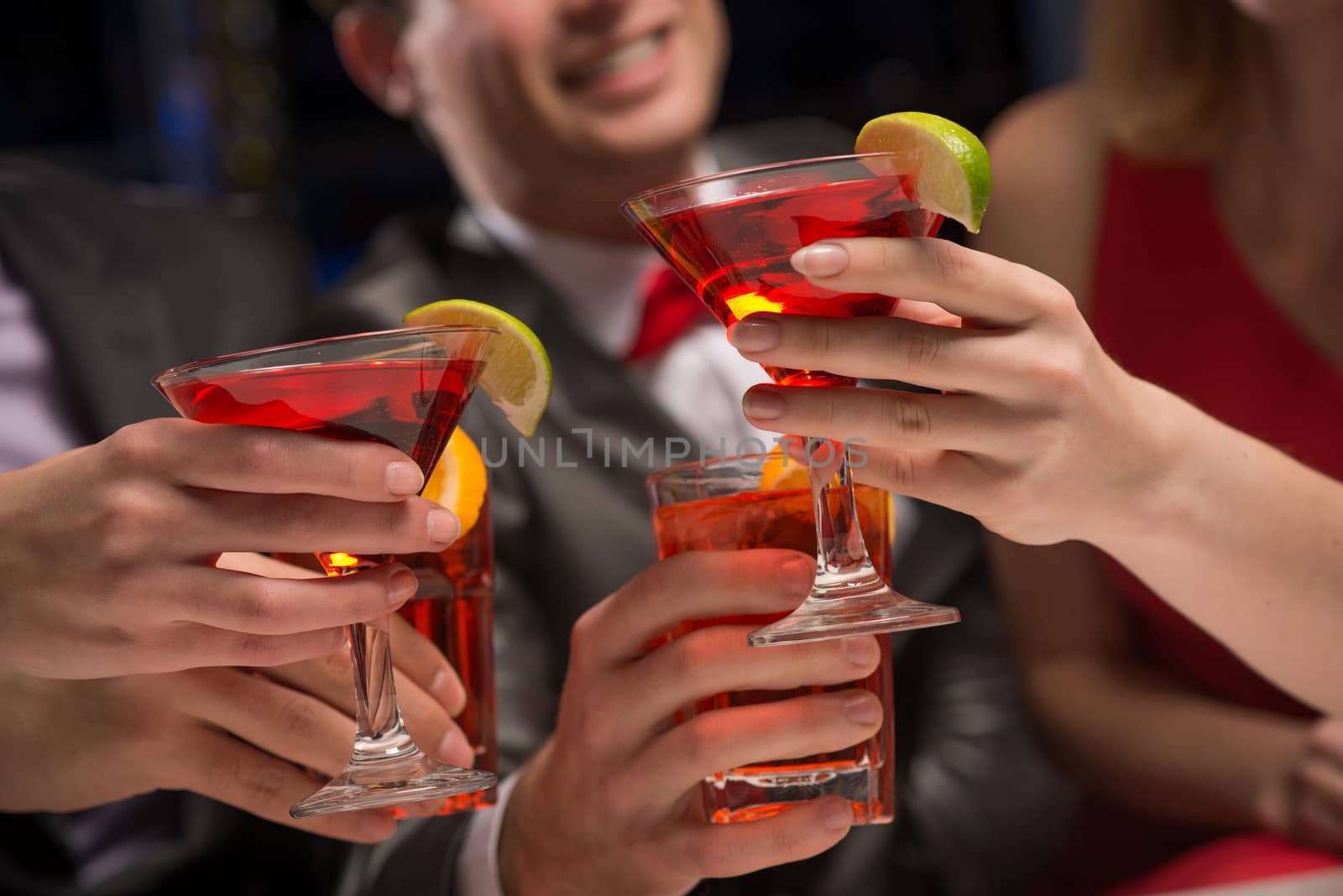 close-up of hands with glasses, a toast, party with friends