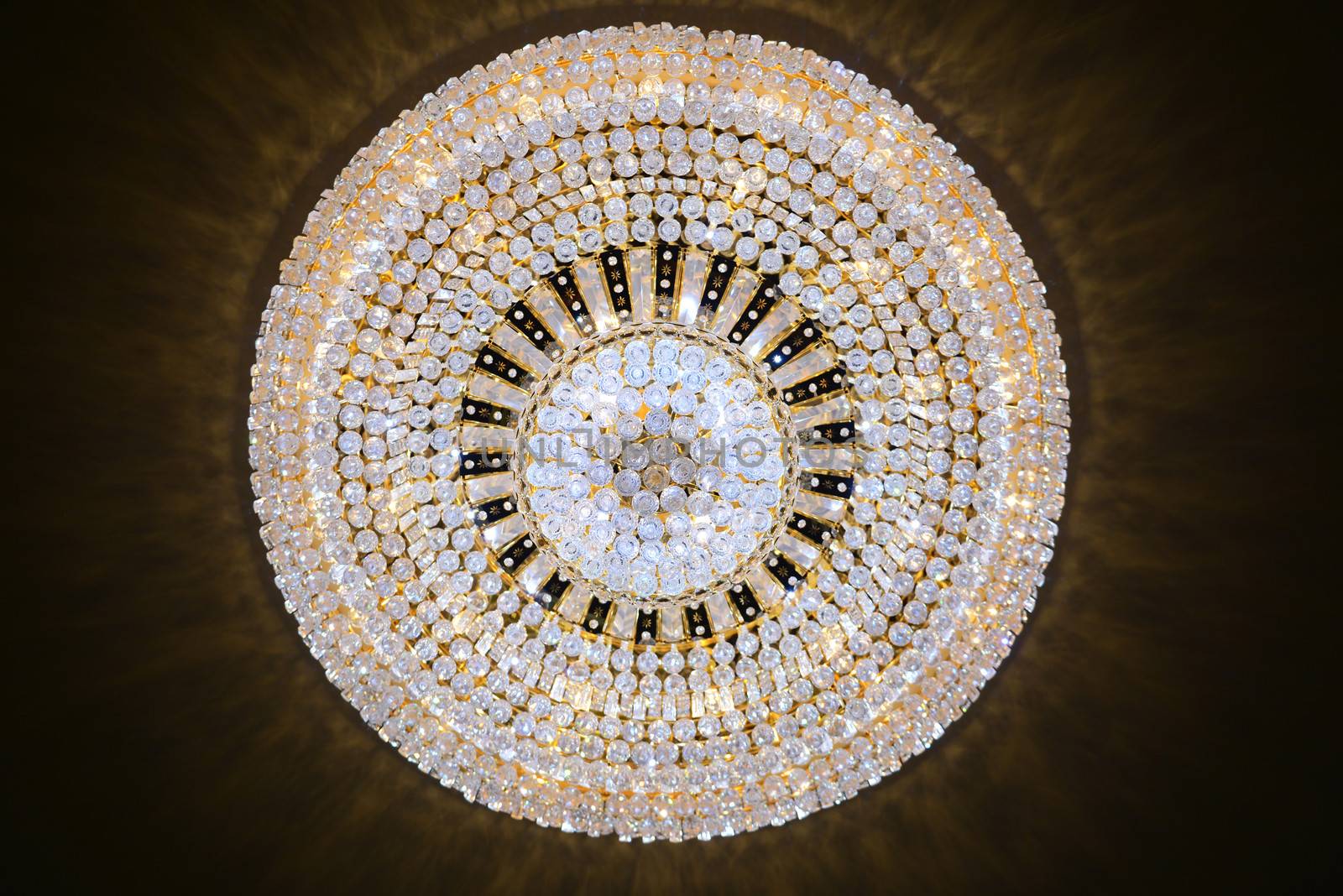 Contemporary glass chandelier hanging on the ceiling