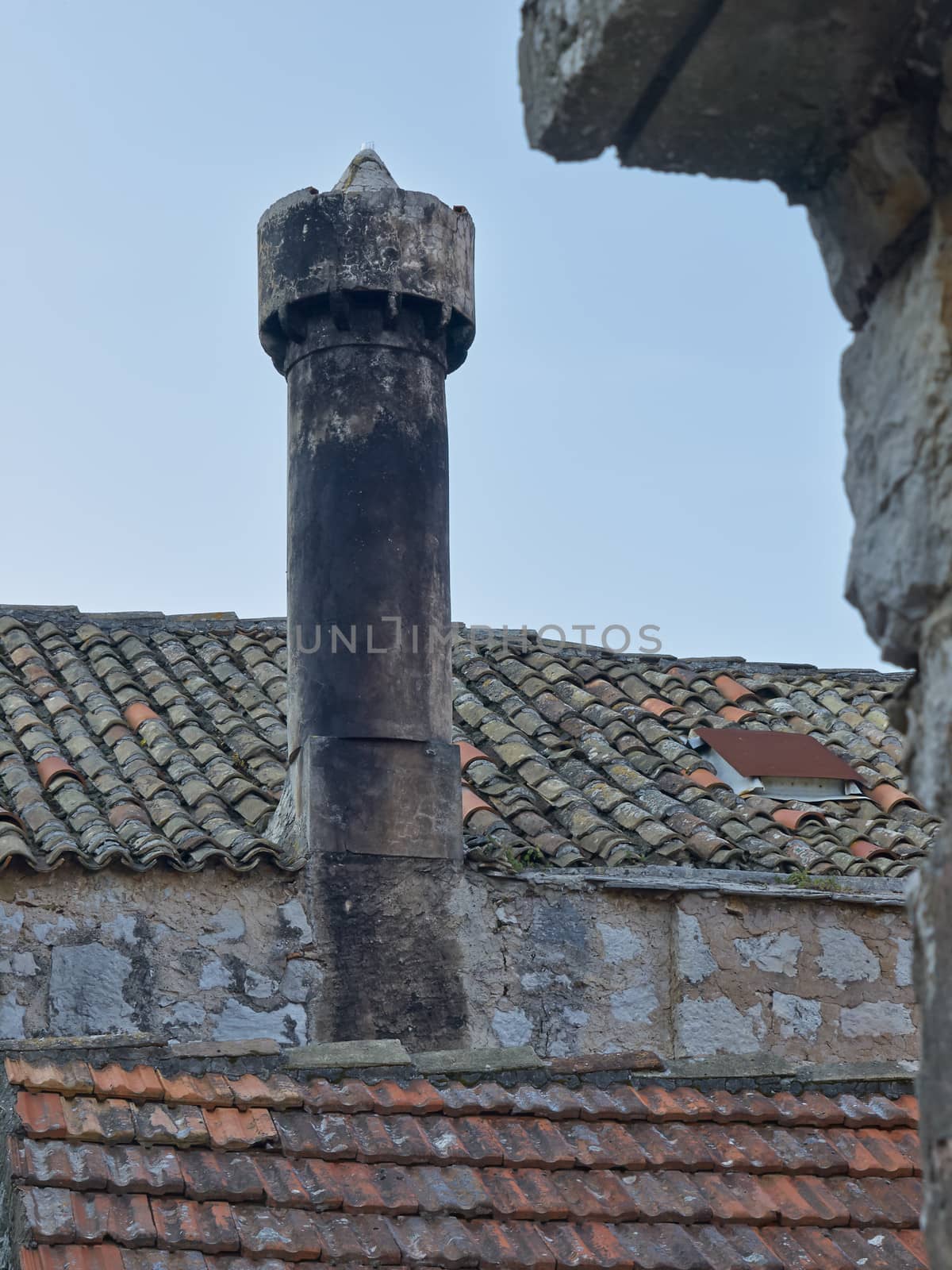 Old chimney and old roof tiles on island Lastovo       