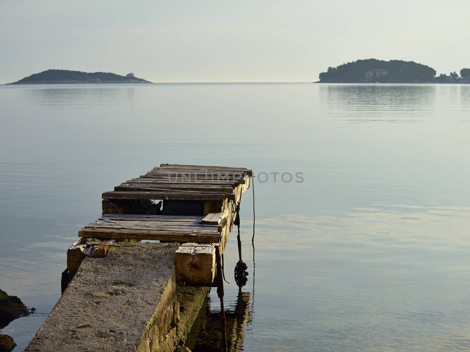 Old wooden pier in island of Vis, Croatia, Adriatic sea         