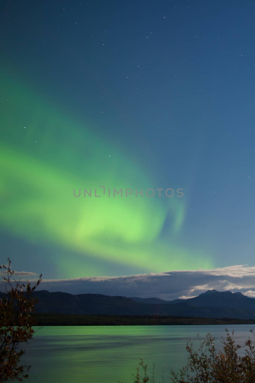 Moon-lit clouds northern lights over Lake Laberge by PiLens