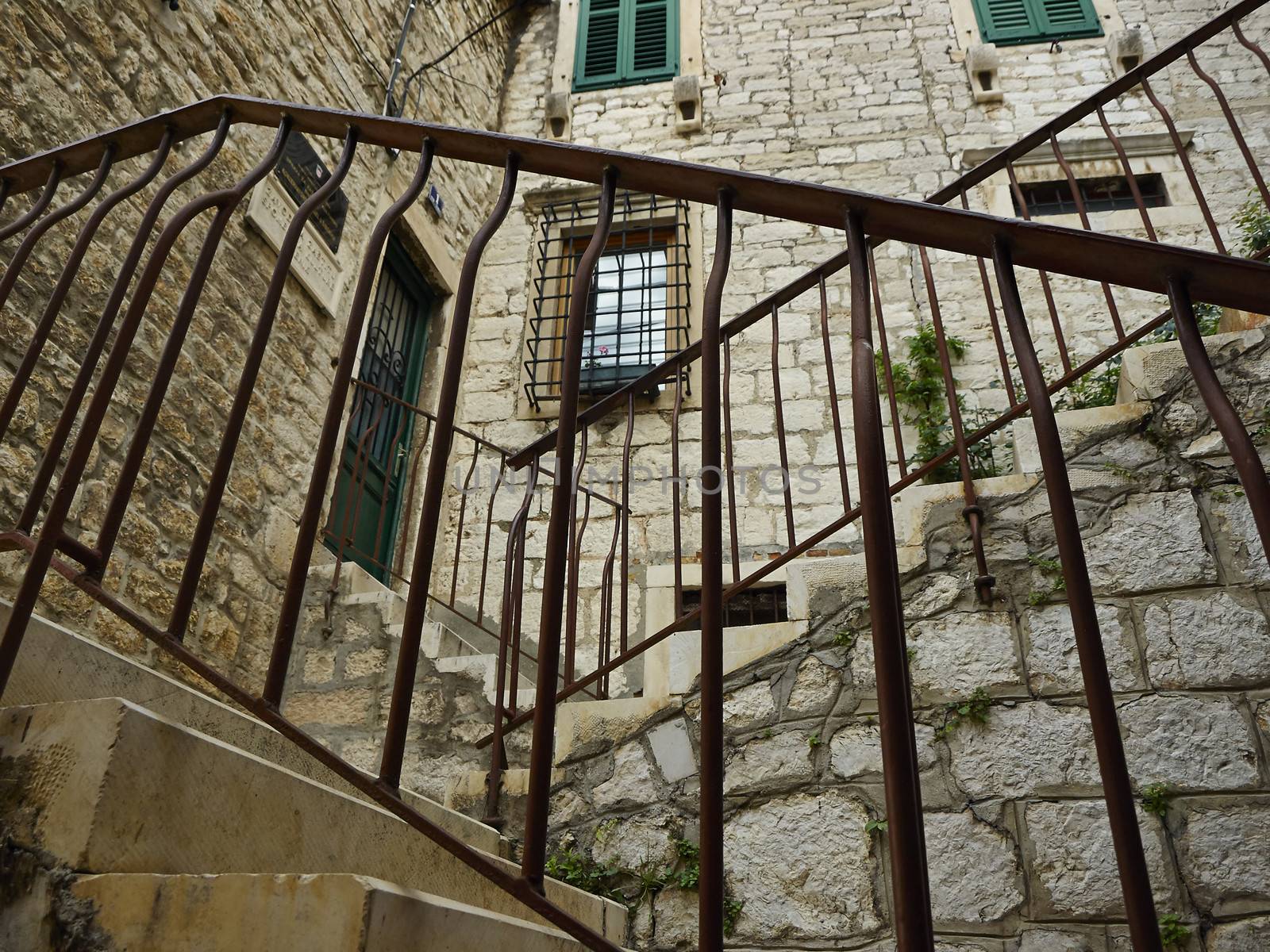 Stairs with metal brackets in old town Shibenik       
