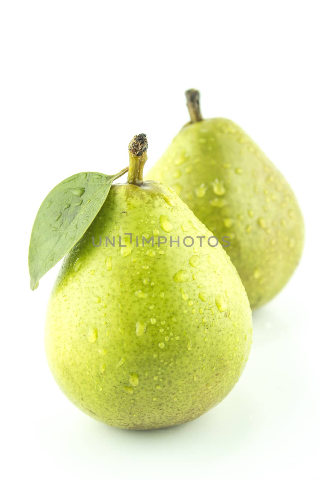 Fresh Green Pears with leaf on white