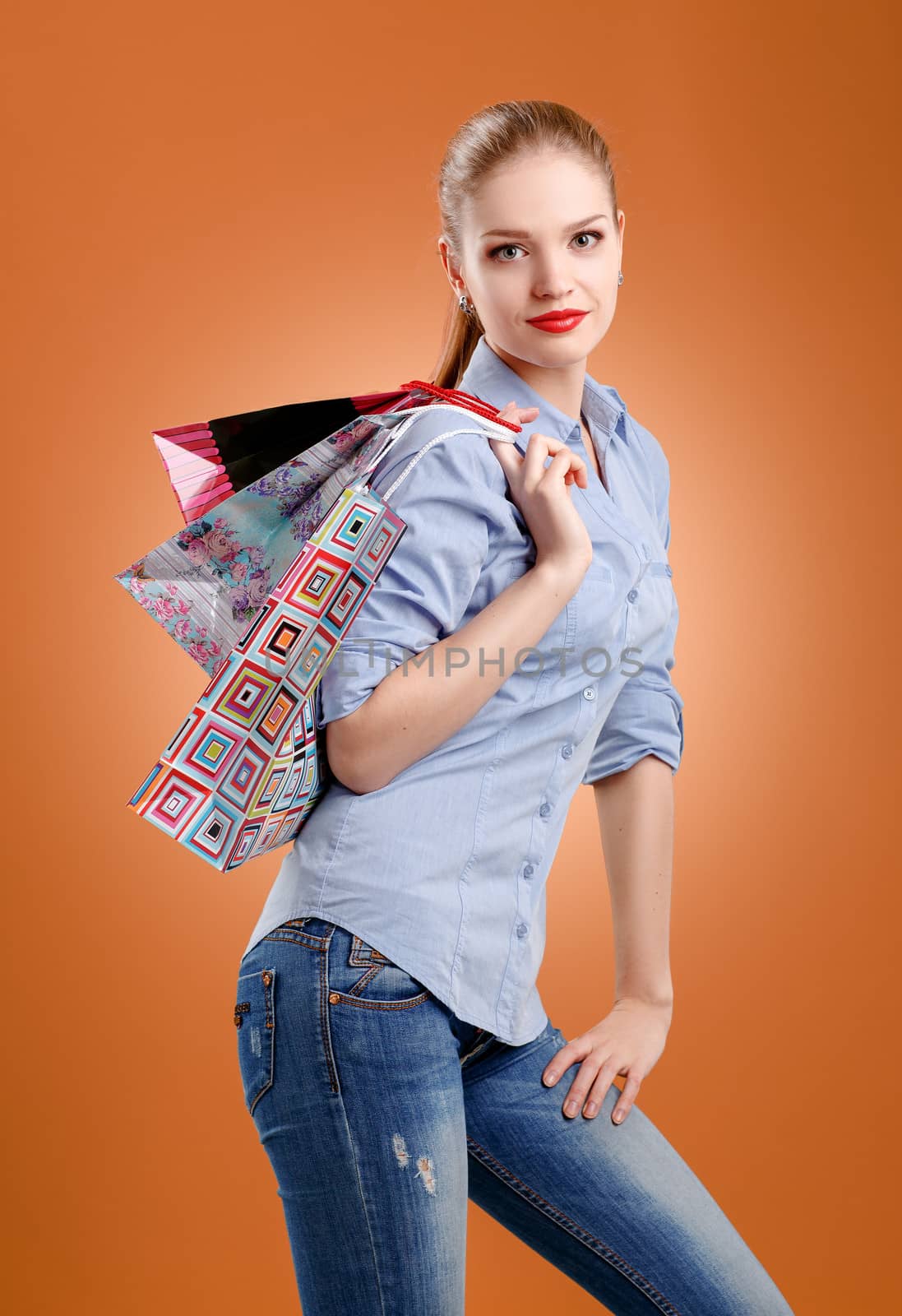 girl with a gift box on a beige background