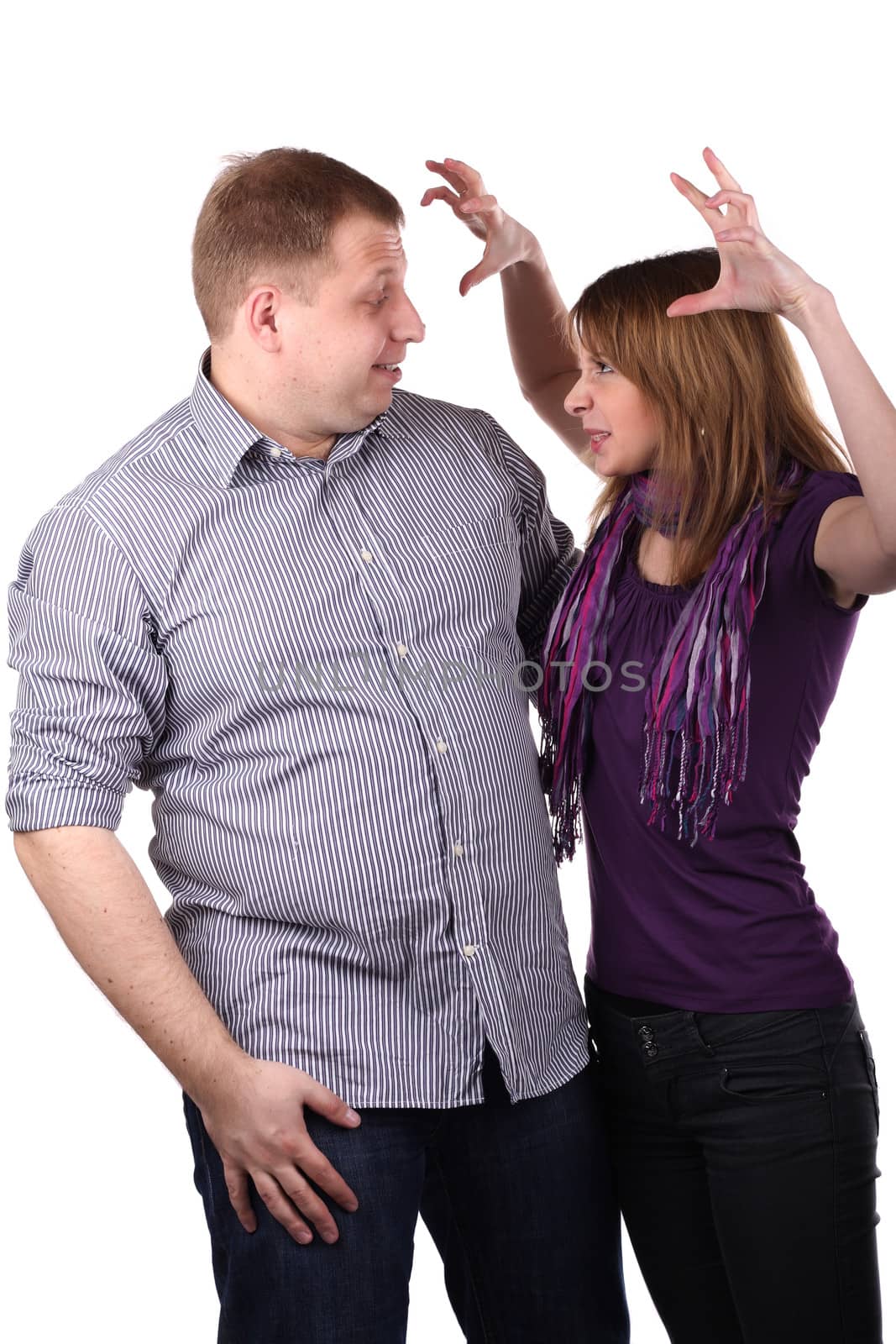 Young Lovely couple joking isolated on the white background