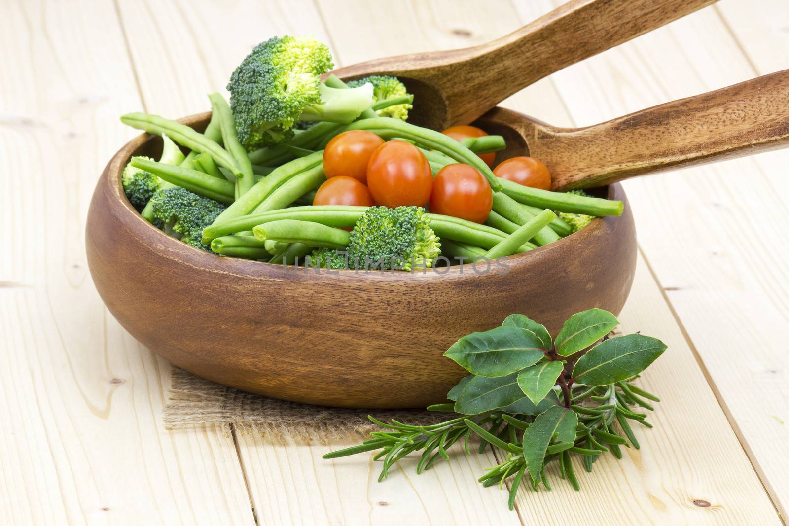 Vegetables and herbs: broccoli, green beans and tomatoes in a bowl