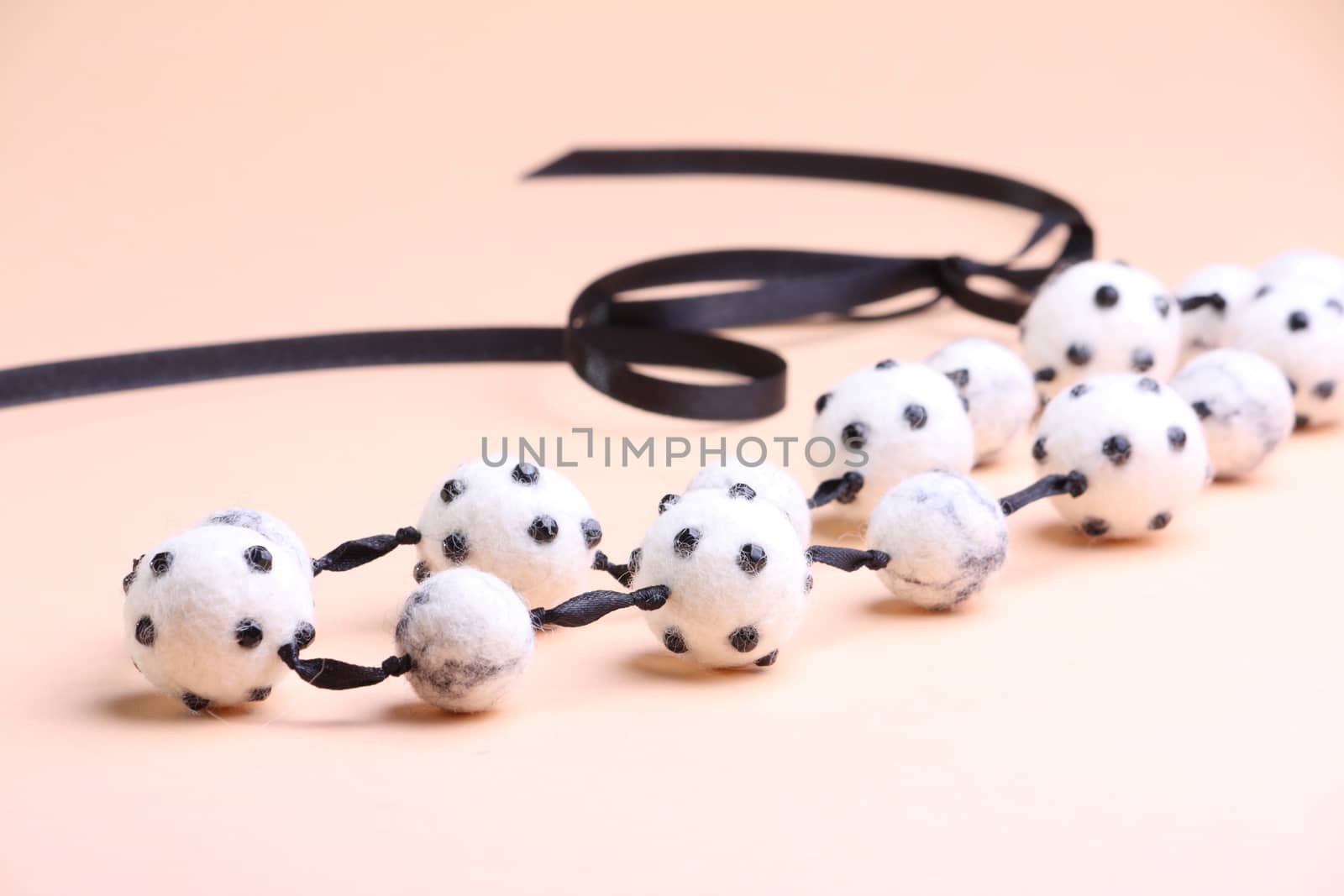 White beads at pink background by dedmorozz