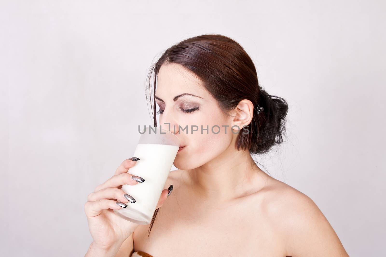Beautiful girl drinking milk by dukibu