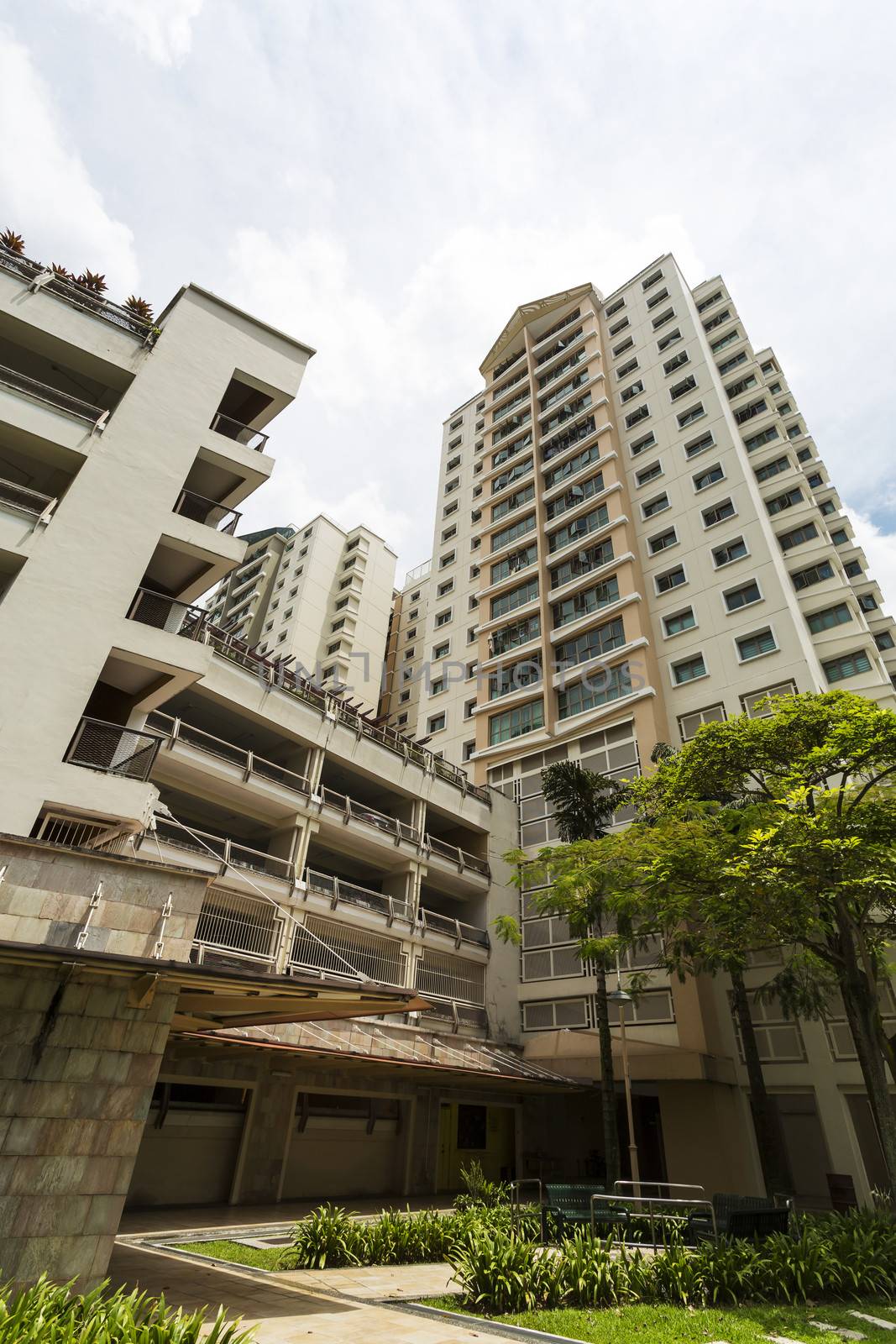 Vertical low angle shot of a residential estate with car park. 