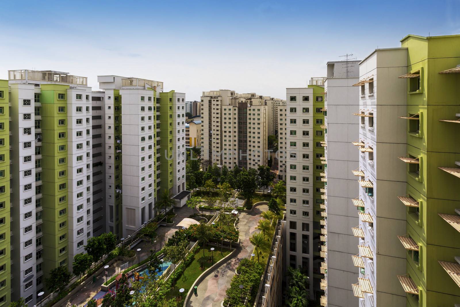 High angle shot of a residential estate with carpark, garden and playground