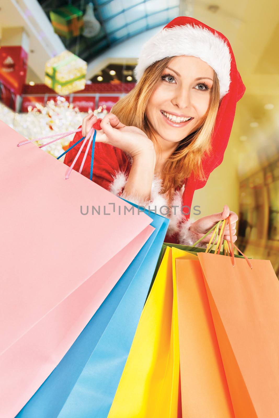 happy smiling Santa woman shopping, background digitaly added, workpath