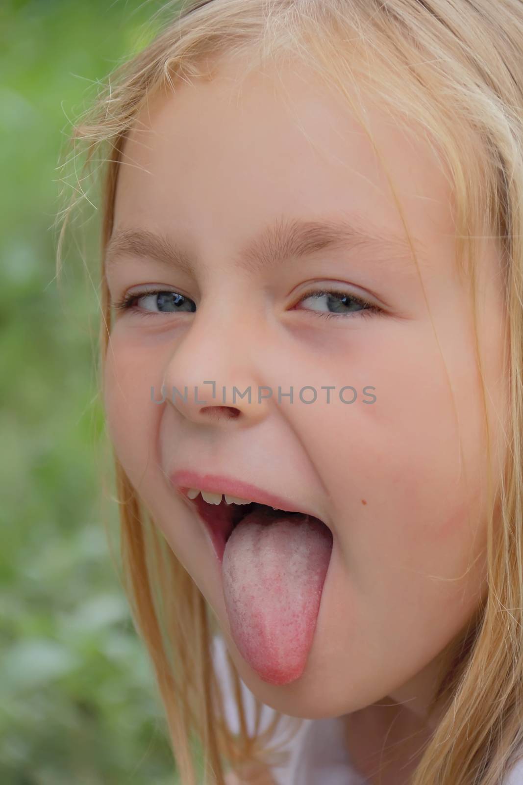 Portrait of girl with smile and makes faces