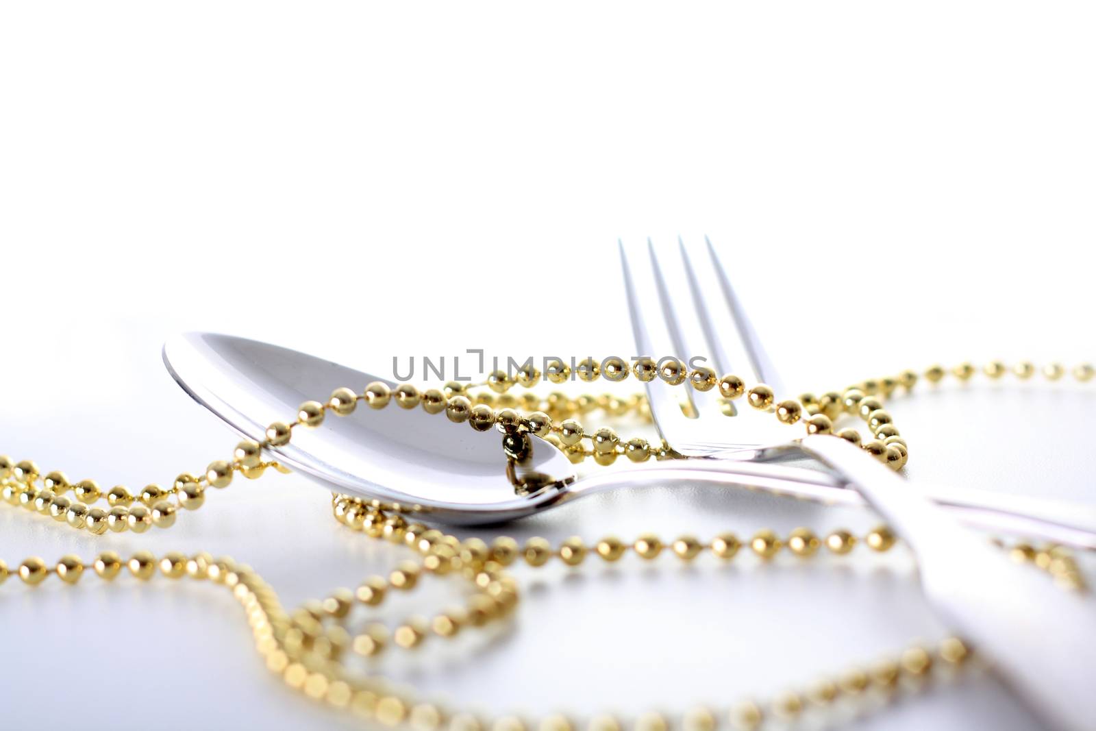  spoon and fork with decoration and white background 