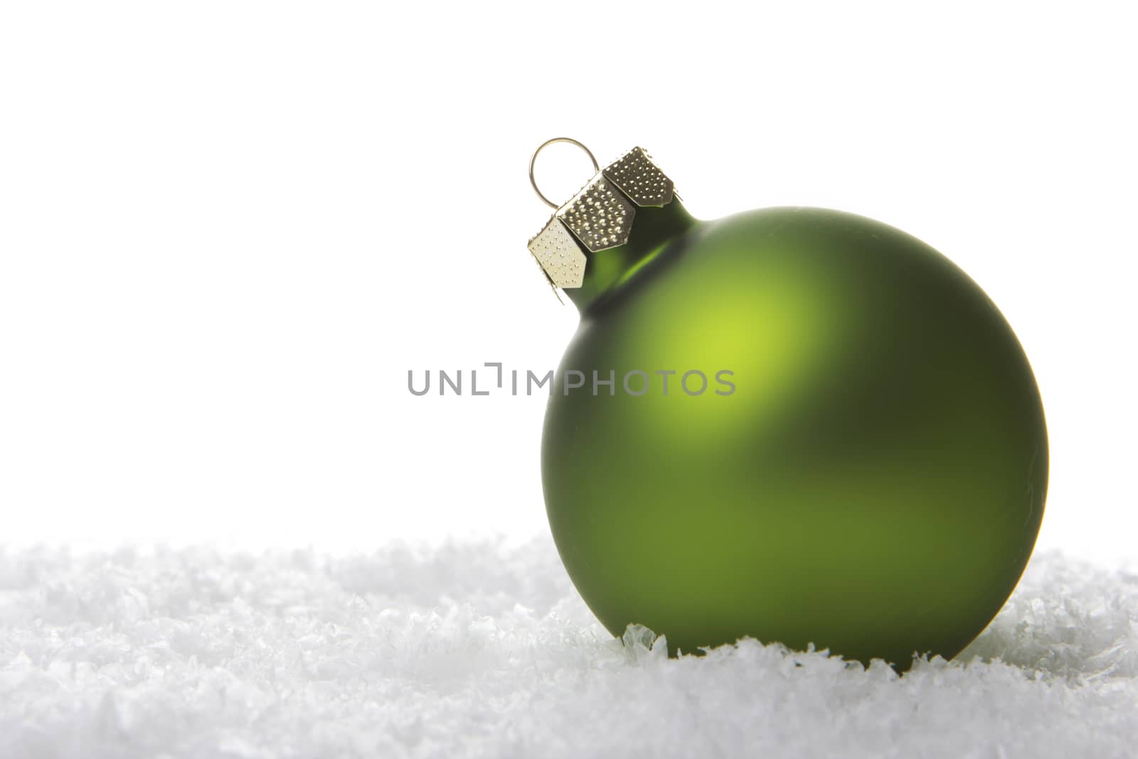 christmas, green christmas bauble on snow 