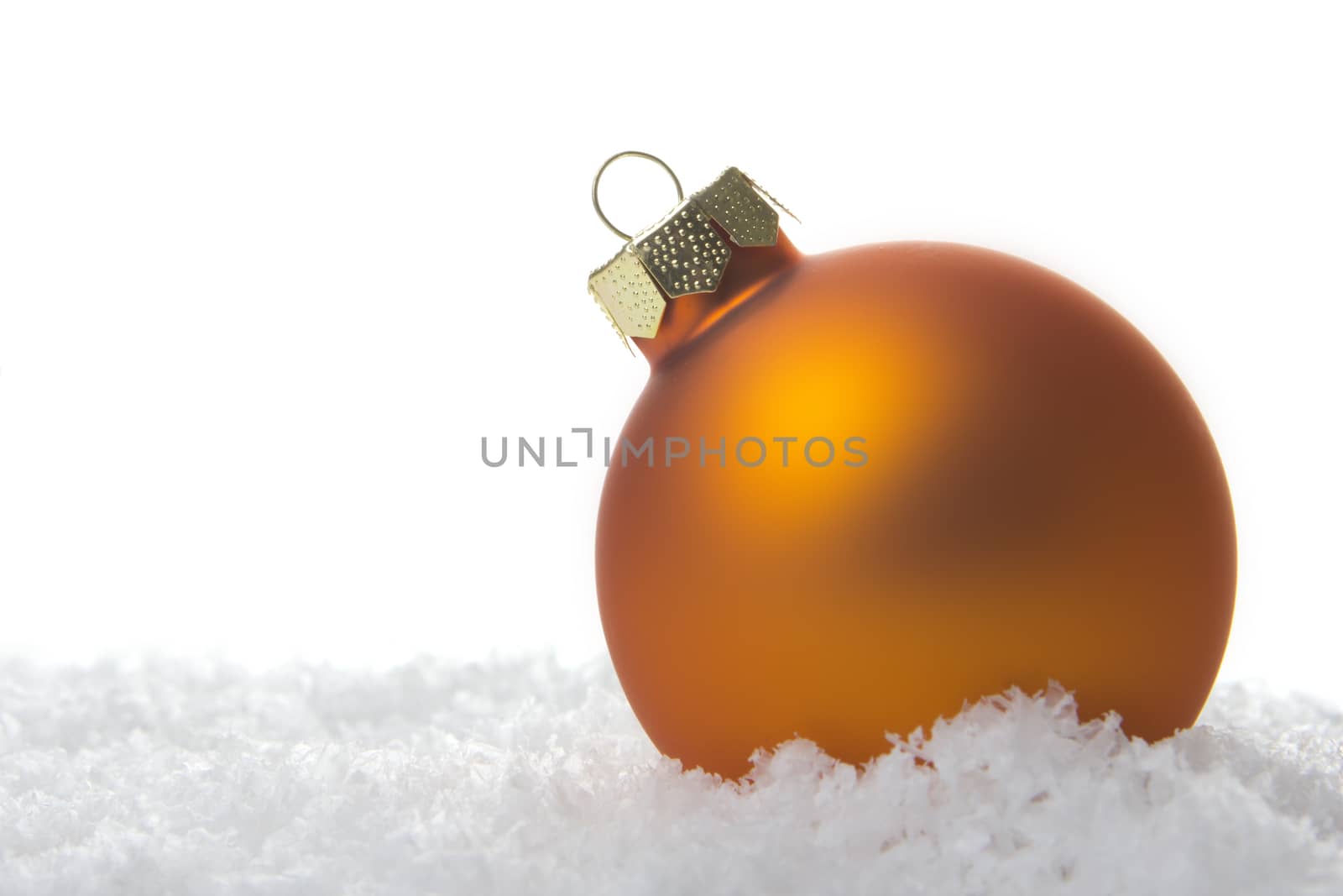 christmas, orange christmas bauble on snow 