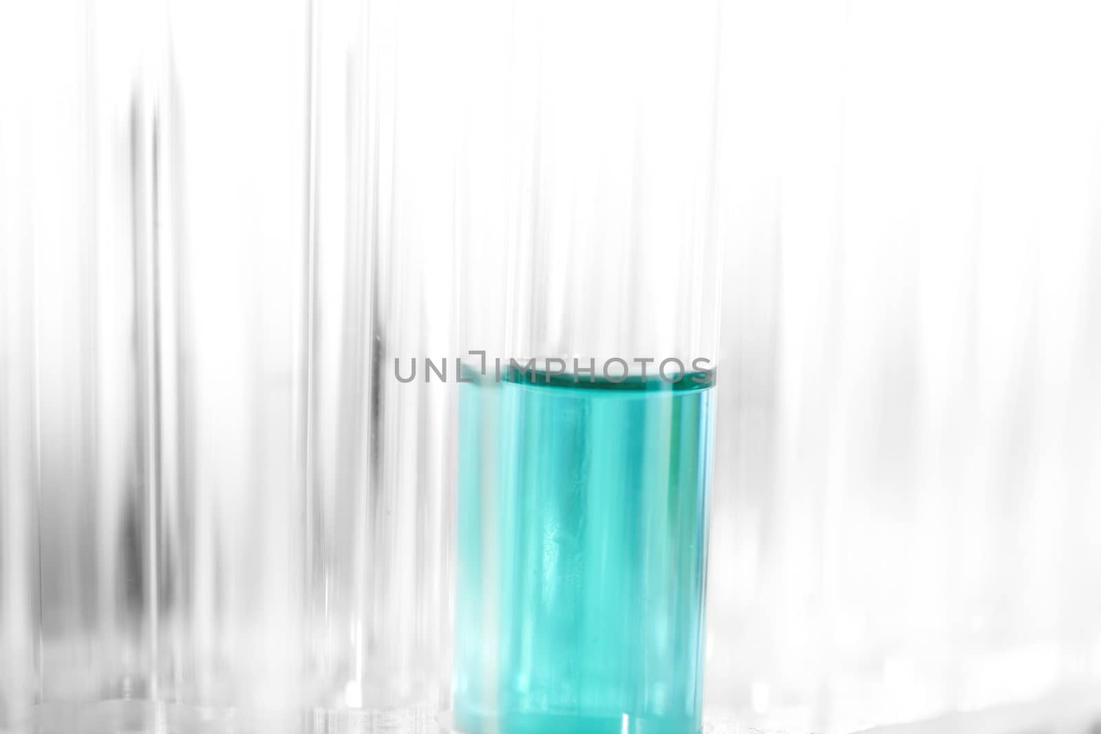 test tubes with blue liquid 