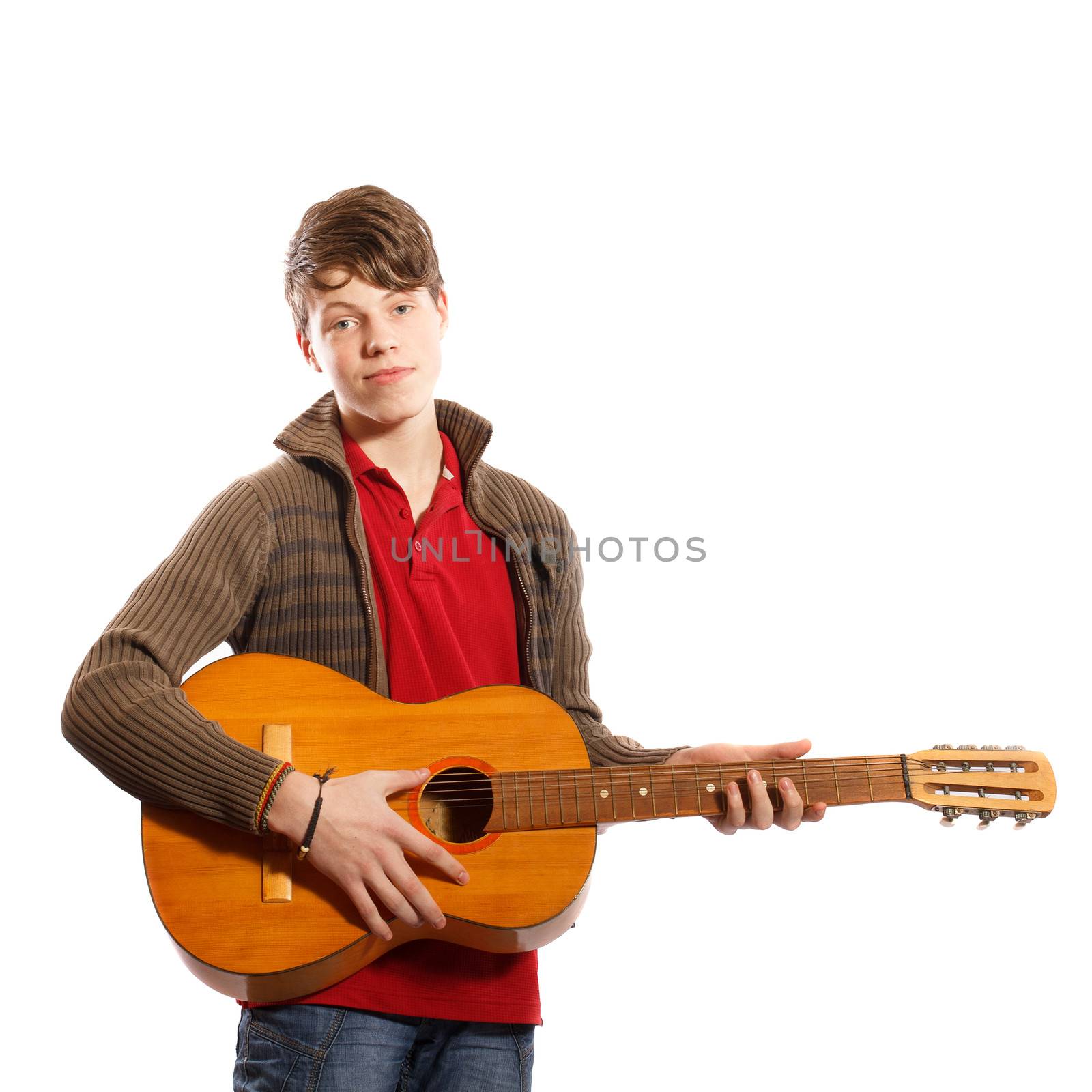 Teenager with a guitar on a white background