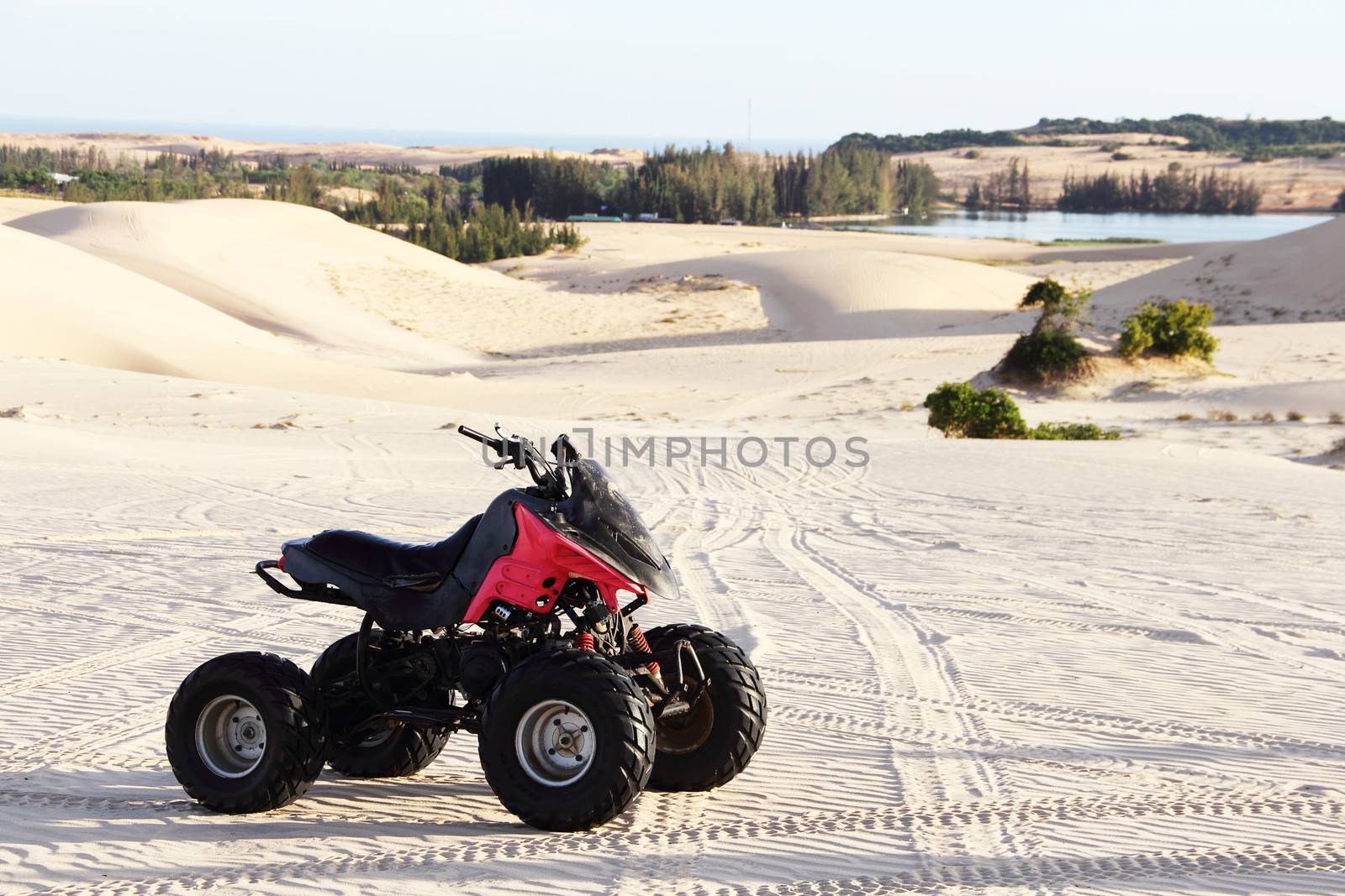 Quad bike in sand desert close-up