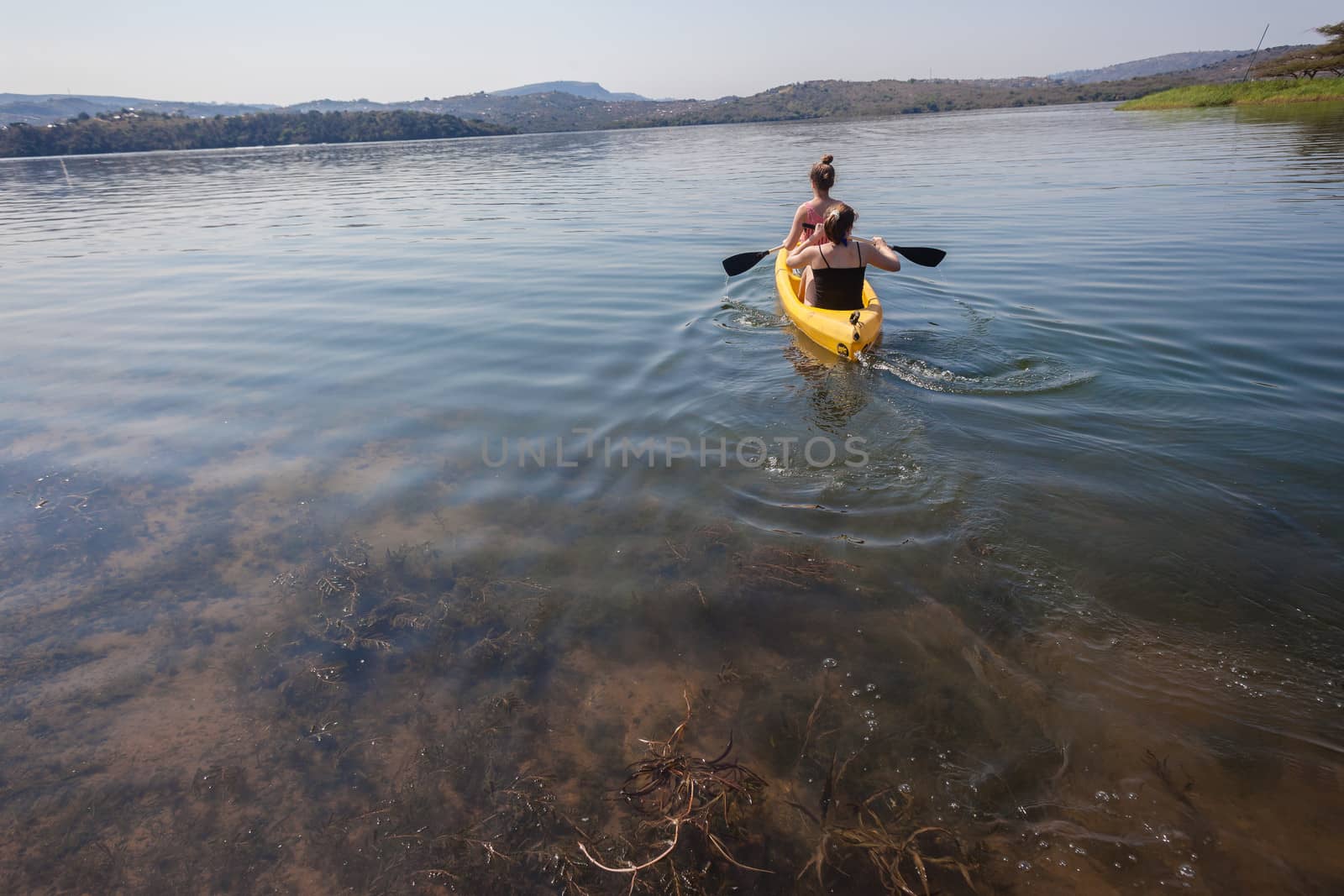 Girls Canoe Explore by ChrisVanLennepPhoto