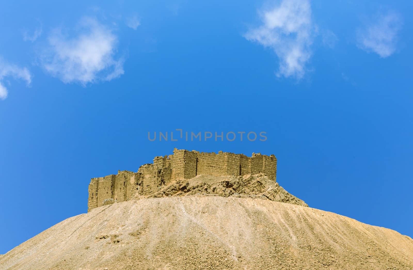 old castle, overlooking ancient Roman time town in Palmyra, Syria