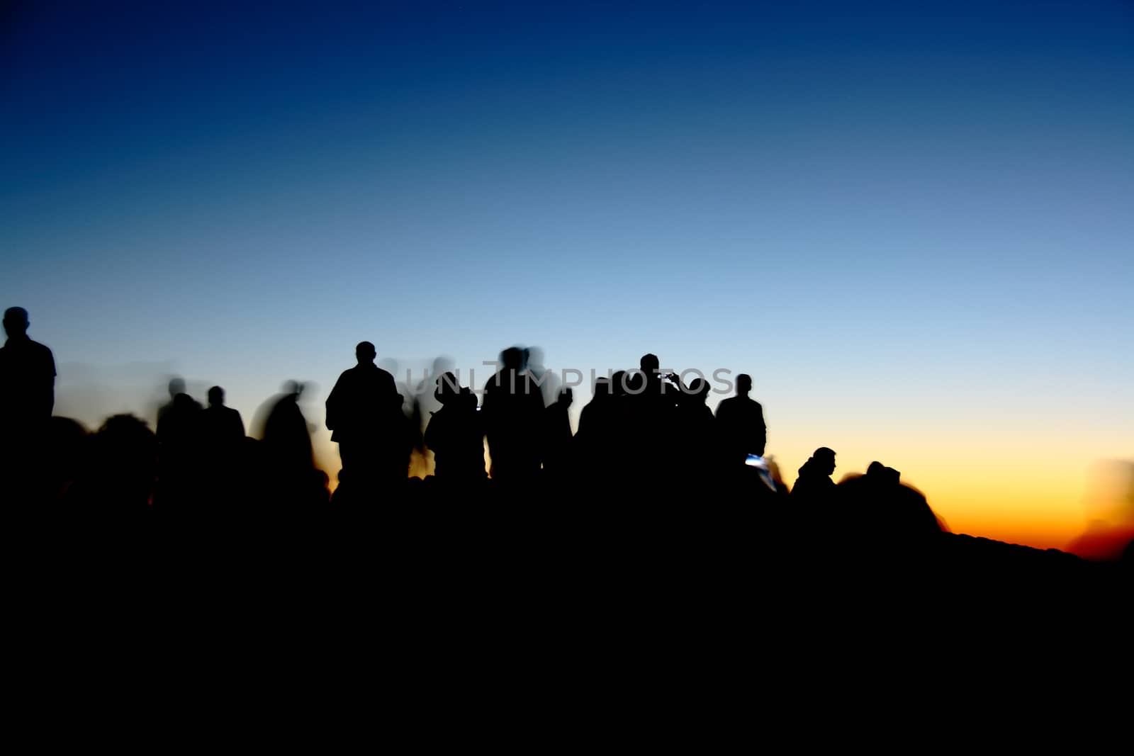 people silhouettes  on nemrut mountain waiting sunrise