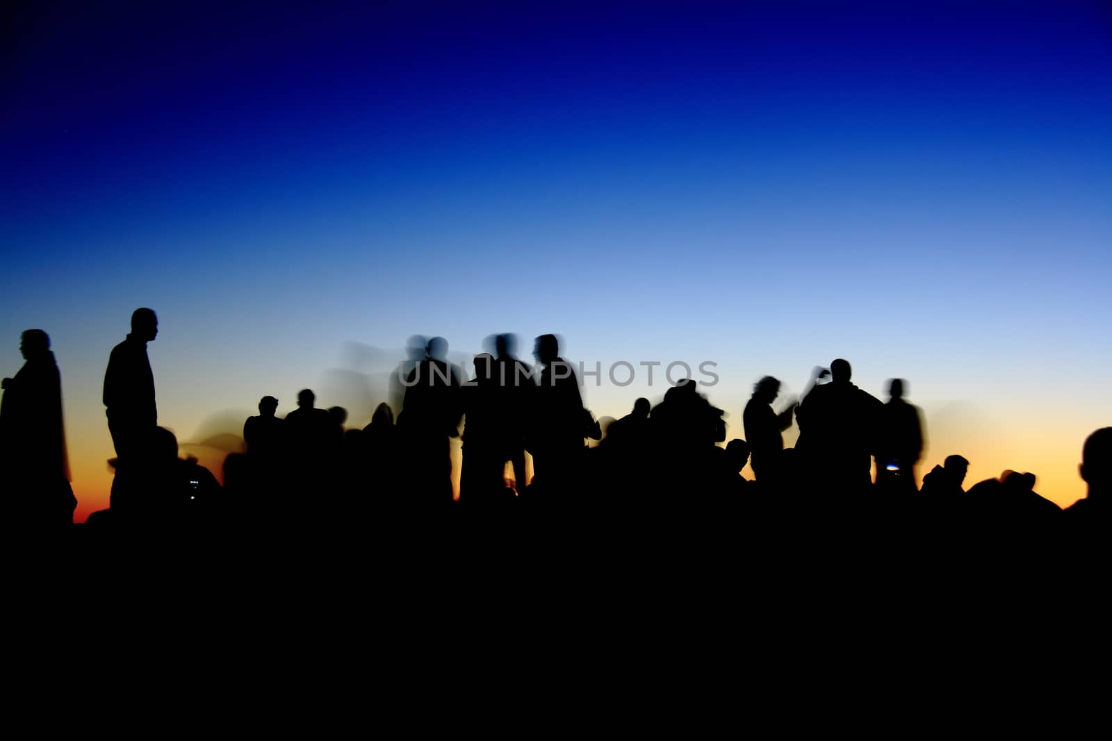 people silhouettes  on nemrut mountain waiting sunrise