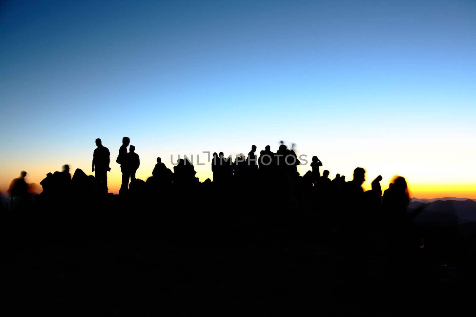 people silhouettes  on nemrut mountain waiting sunrise